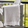 Sunbrella Herringbone Throw Draped